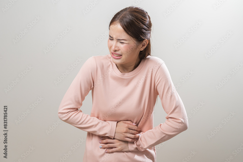 Flatulence asian young woman intolerance hand in stomach ache, suffer from food poisoning, abdominal pain and colon problem, gastritis or diarrhoea when at home. Patient belly, abdomen or inflammation Flatulence asian young woman intolerance hand in stomach ache, suffer from food poisoning, abdominal pain and colon problem, gastritis or diarrhoea when at home. Patient belly, abdomen or inflammation
