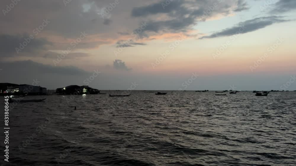 people snorkeling at sunset island sea near the rocky shore people snorkeling at sunset island sea near the rocky shore