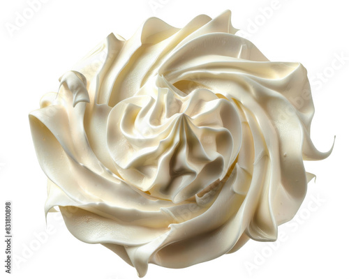 Close-up of a beautifully swirled dollop of white whipped cream, isolated on a white background.