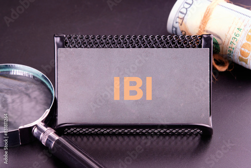 IBI (Inter beat Interval) written on a gray business card in golden letters photo