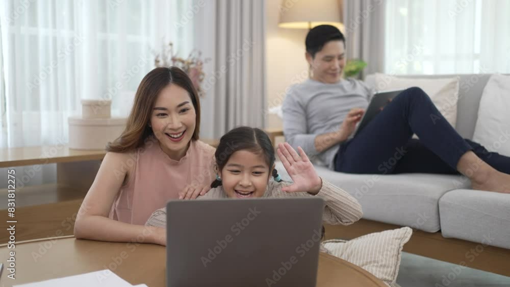 Parents and daughter studying via internet at home. Parents and daughter studying via internet at home.