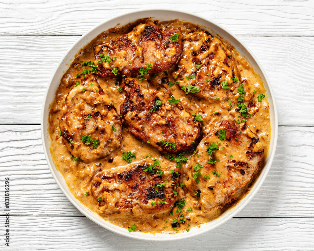 creamy smothered pork chops cooked in onion gravy creamy smothered pork chops cooked in onion gravy