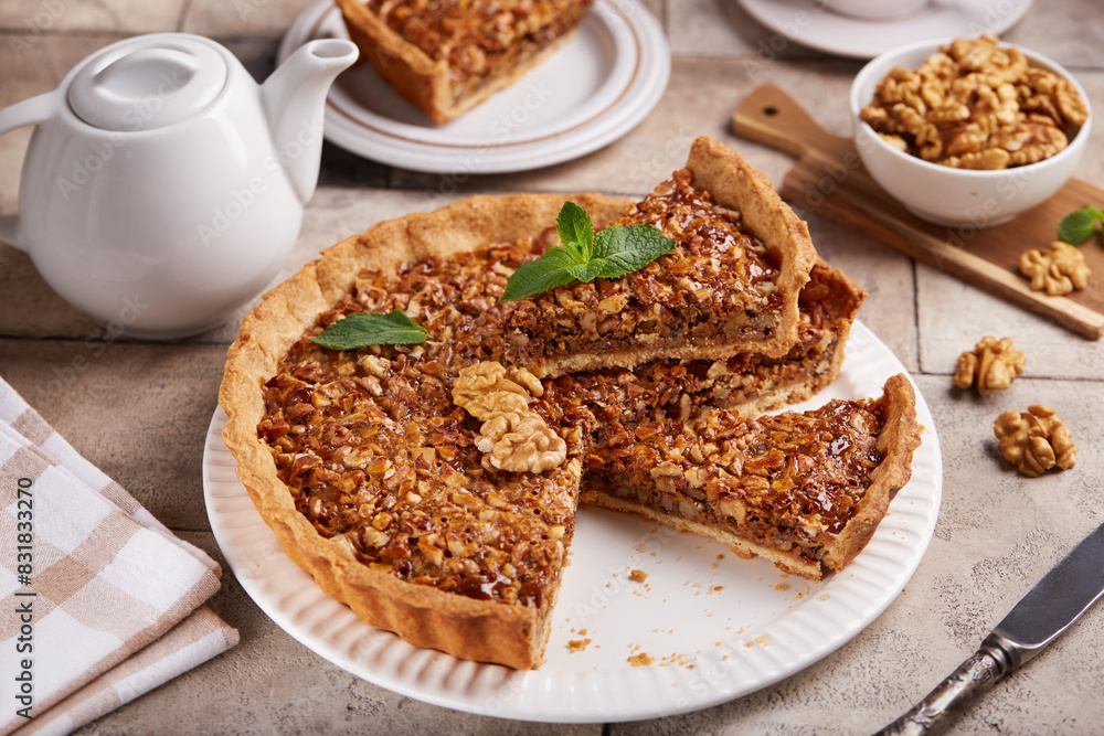 Tart with walnuts and caramel cream filling. Sweet homemade dessert. Tart with walnuts and caramel cream filling. Sweet homemade dessert.