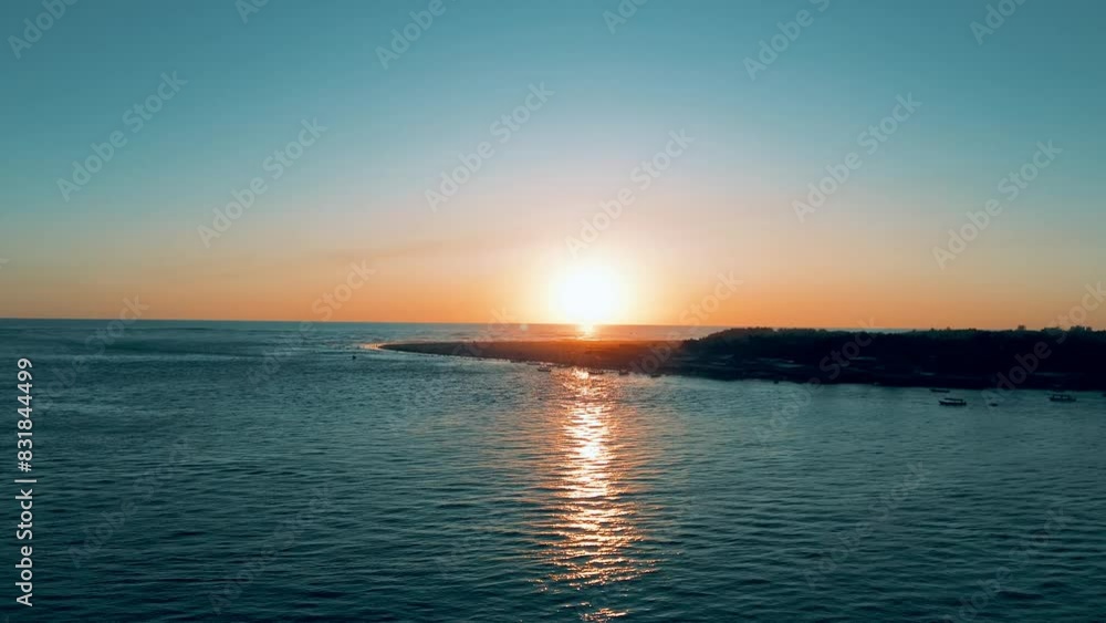 Aerial shot with drone upward movement of sunset and dusk in mouth that connects the Pacific Ocean and estuary island in the foreground Aerial shot with drone upward movement of sunset and dusk in mouth that connects the Pacific Ocean and estuary island in the foreground