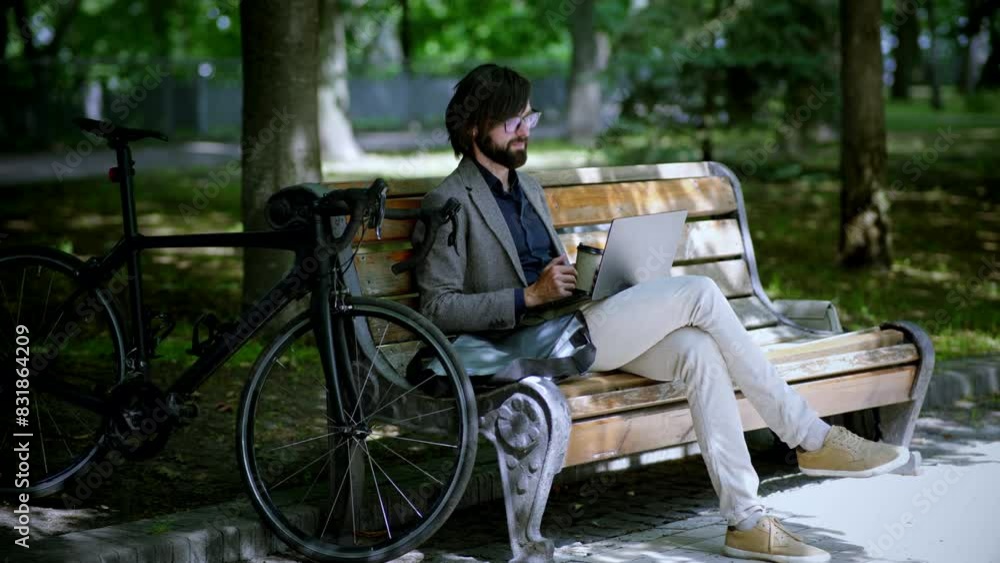 Man sitting bench with computer overtime working outdoor Man sitting bench with computer overtime working outdoor