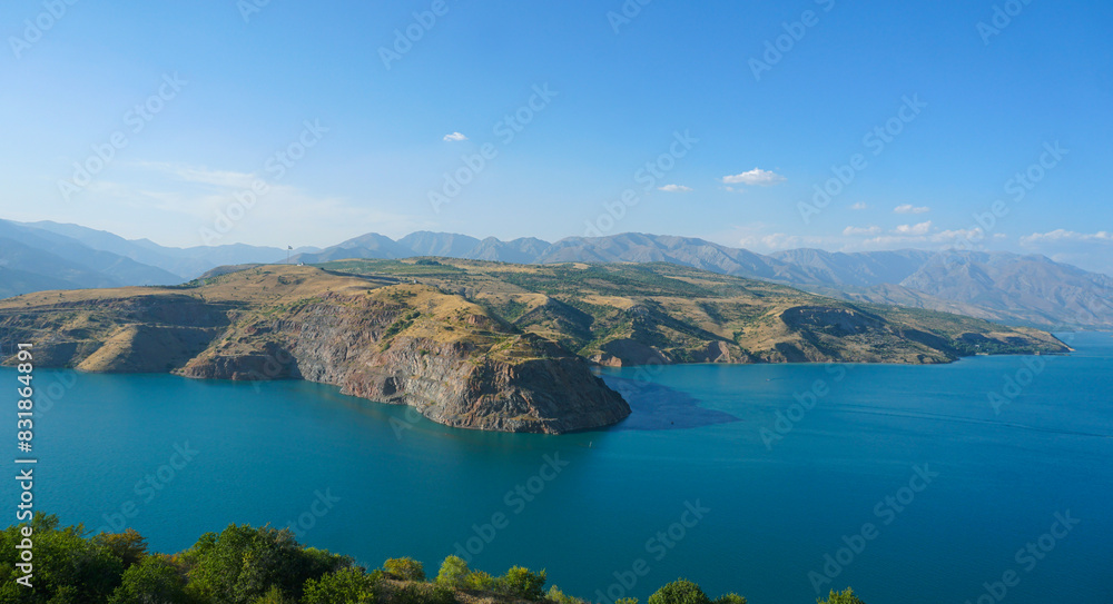 Fototapeta premium A large reservoir between the mountains