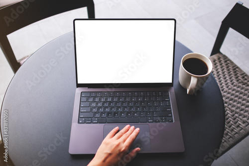 Top view mockup image of a woman using and touching on laptop touchpad with blank white desktop screen