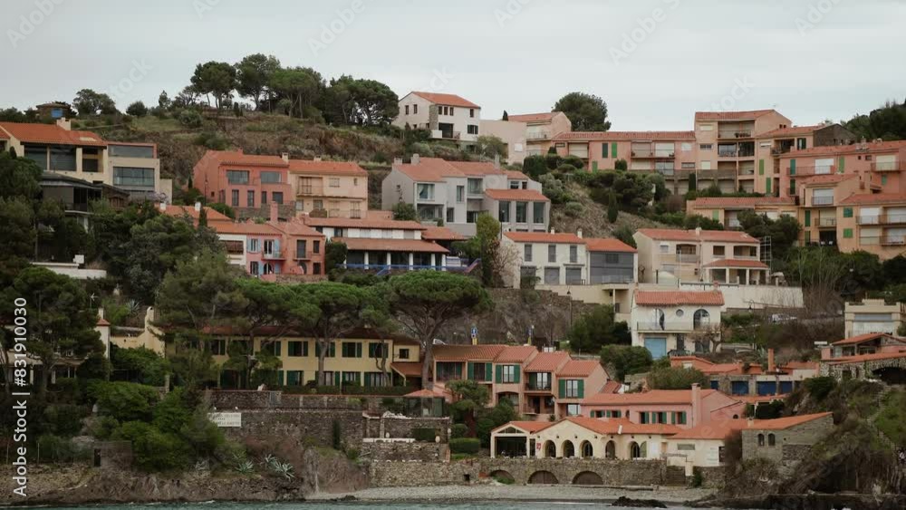 Mediterranean city in France with many houses on a cliff. Calm cloudy and windy day in spring. Mediterranean city in France with many houses on a cliff. Calm cloudy and windy day in spring.