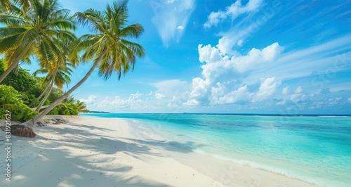 Beautiful tropical beach with white sand, palm trees, turquoise ocean against blue sky with clouds on sunny summer day, Maldives.