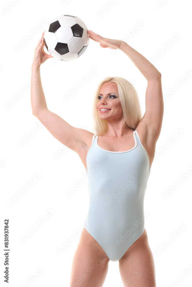 woman wearing swim suit and holding soccer ball