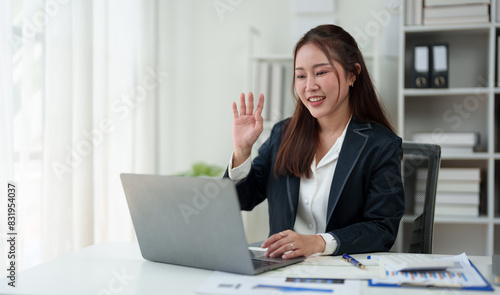 Asian businesswoman working on laptop online communicating Financial contact information with customers, planning, business success in the office modern online business ideas.