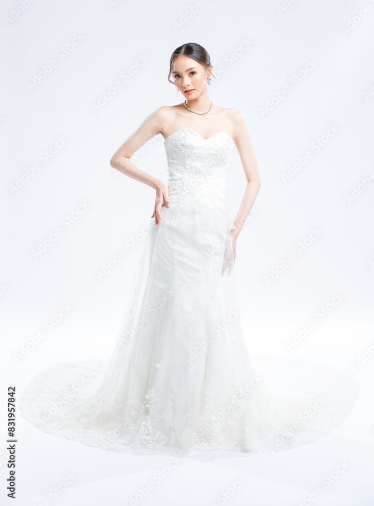Asian young beautiful female portrait attractive model gorgeous charming bride wearing fashion wedding dress luxury perfect style, posing standing smile looking camera isolated white background studio Asian young beautiful female portrait attractive model gorgeous charming bride wearing fashion wedding dress luxury perfect style, posing standing smile looking camera isolated white background studio