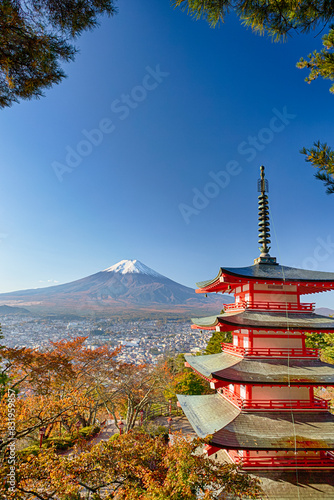 Famous Japan Destinations. Renowned Kiyomizu-dera Temple Pagoda Against Kyoto Skyline with Traditional Red Maple Trees Against Fuji Mountain