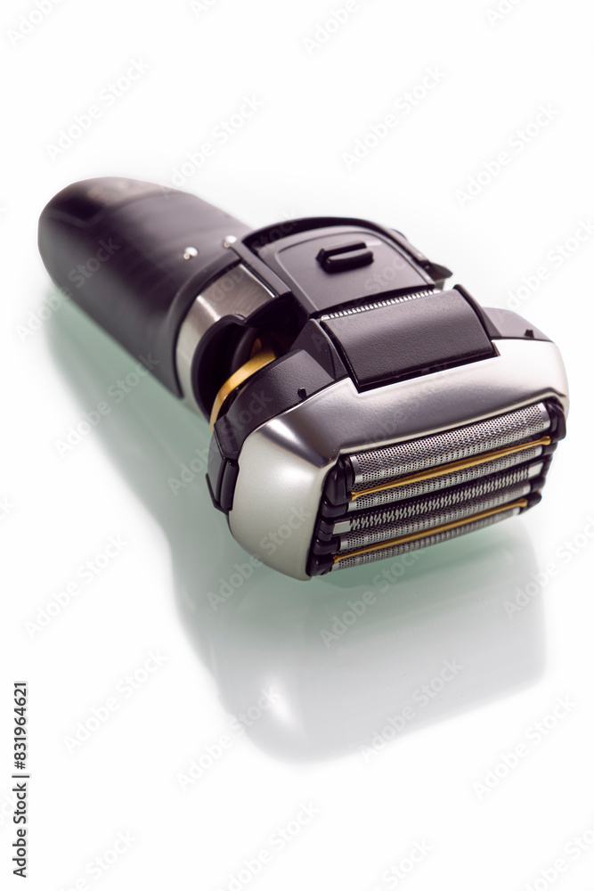 Closeup and Upper View of Of Modern Electric 5 Blades Stainless Steel Shaver Over Reflective White Closeup and Upper View of Of Modern Electric 5 Blades Stainless Steel Shaver Over Reflective White