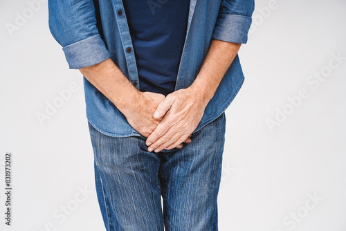 Foto Close up of mature man suffering from pain isolated on white