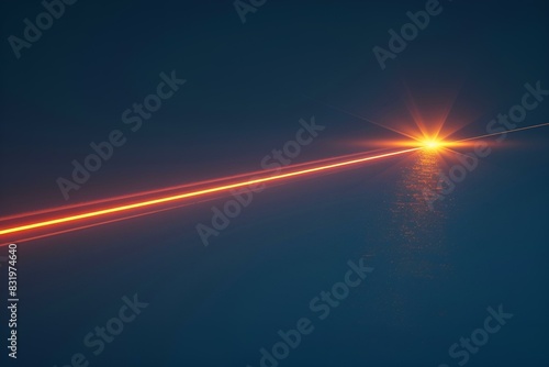 Wschodzące słońce nad morzem z laserowym promieniem © Henryk Guziak