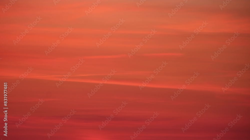 At dusk, the sunset bathed the cloudscape in a stunning red light, time lapse At dusk, the sunset bathed the cloudscape in a stunning red light, time lapse