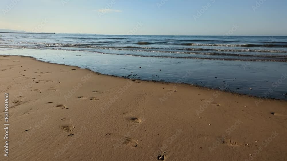 Slow Motion Calm Waves Rolling into Swansea Bay in Early Morning Slow Motion Calm Waves Rolling into Swansea Bay in Early Morning