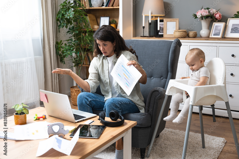 Young single divorced mother with baby using laptop computer for video call with her lawyer, talking about ex husband who not paying alimony and expenses and cost of living with small child. Young single divorced mother with baby using laptop computer for video call with her lawyer, talking about ex husband who not paying alimony and expenses and cost of living with small child.