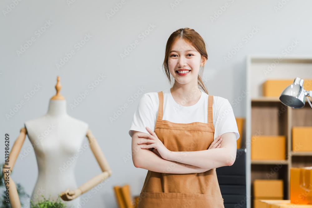 A young Asian businesswoman efficiently manages SMEs, utilizing her desk, tablet, laptop to handle online orders and live streams, showcasing entrepreneurial prowess in the dynamic market landscape. A young Asian businesswoman efficiently manages SMEs, utilizing her desk, tablet, laptop to handle online orders and live streams, showcasing entrepreneurial prowess in the dynamic market landscape.