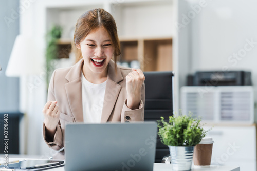 Dynamic young Asian businesswoman adeptly maneuvers through complexities of finance entrepreneurship, leveraging expertise to navigate the competitive landscape with strategic acumen resilience. photo