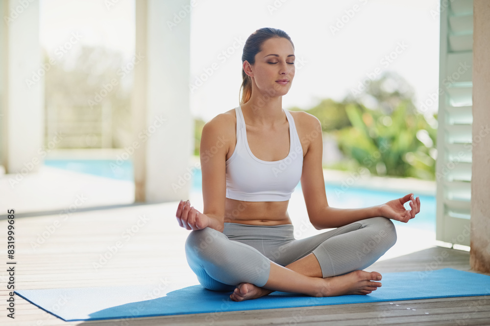 Fitness, meditation and yoga with woman in home for start of holistic wellness routine on exercise mat. Inner peace, pilates and training with yogi person in sportswear for balance or zen workout