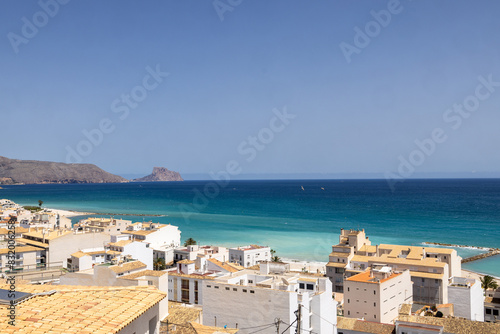 Photo of the beautiful city of Altea in Spain showing an ocean view from the Spanish homes and streets up on a hill on a sunny day in the summer time