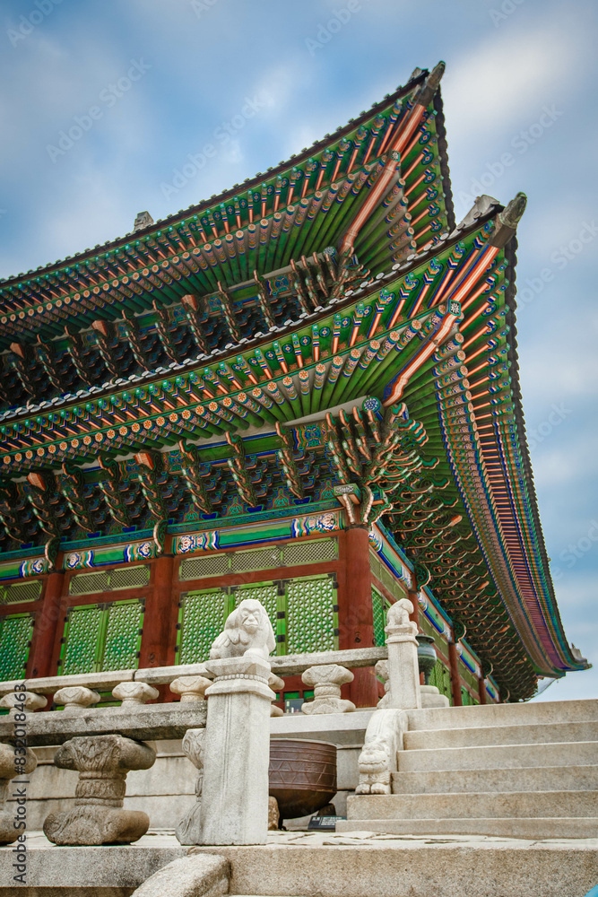 Low angle view of colorful patterned gyeongbokgung roof against sky