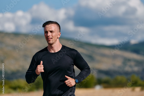 Athletic Man Jogging in the Sun, Preparing His Body for Life's Extreme Challenges © .shock