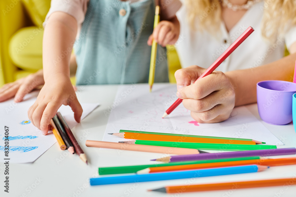 mother and daughter with pencils, exploring creativity and learning together at a table. mother and daughter with pencils, exploring creativity and learning together at a table.