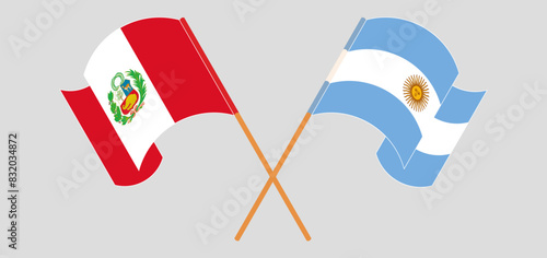Crossed and waving flags of Peru and Argentina