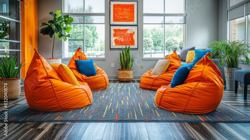 Start-up environment featuring a playful office layout with bean bags, vibrant colors, and motivational posters photo