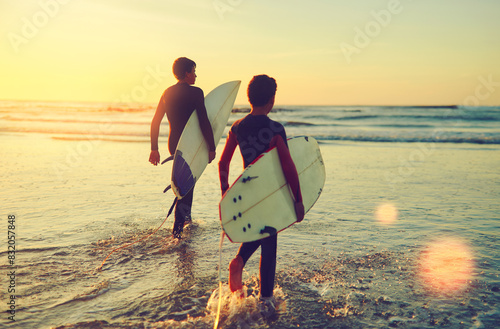 Photography Beach, summer and boys walking with surfboard for holiday, outdoor adventure and weekend together