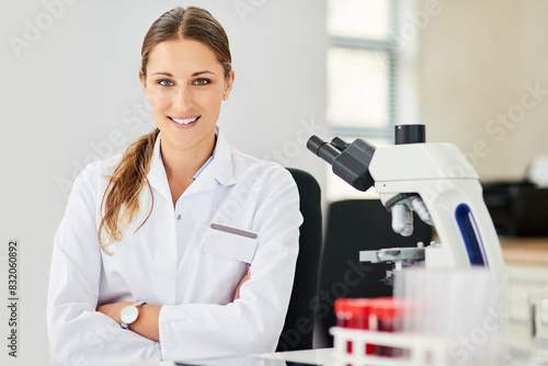 Portrait, smile and female scientist with microscope for research, confidence and medicine development in lab. Happy, woman and biochemistry with equipment for science, experiment and biotechnology