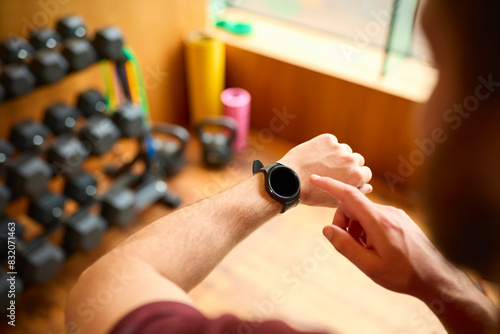 Close Up Shot Of Man Exercising In Gym Checking Health Monitoring App On Smart Watch