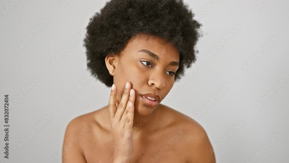 A beautiful woman with afro hair posing thoughtfully against a white background, embodying grace and natural beauty. A beautiful woman with afro hair posing thoughtfully against a white background, embodying grace and natural beauty.