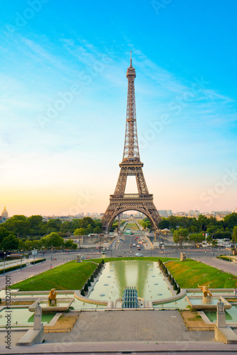 Paris Eiffel Tower and Trocadero garden at sunset in Paris, France. Eiffel Tower is one of the most famous landmarks of Paris.