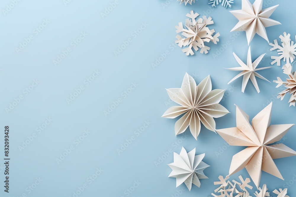 Christmas Paper Star, Ball Decoration. Handmade Christmas Nordic Decor on Light Blue Background, Copy Space. Boho, Scandinavian Style Design. DIY Minimal Ornament. Structural Origami. Zero Waste Idea Christmas Paper Star, Ball Decoration. Handmade Christmas Nordic Decor on Light Blue Background, Copy Space. Boho, Scandinavian Style Design. DIY Minimal Ornament. Structural Origami. Zero Waste Idea
