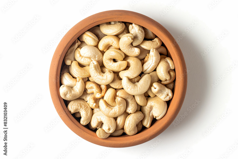 a bowl of cashews on a white surface a bowl of cashews on a white surface