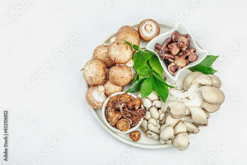 Assortment of various mushrooms - fresh, dried and pickled. Oyster, cremini, porcini and shiitake