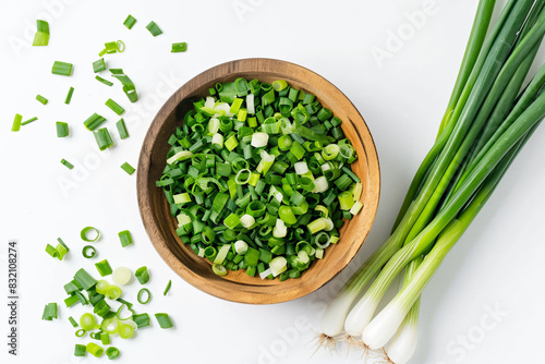 a bowl of green onions and some green onions photo