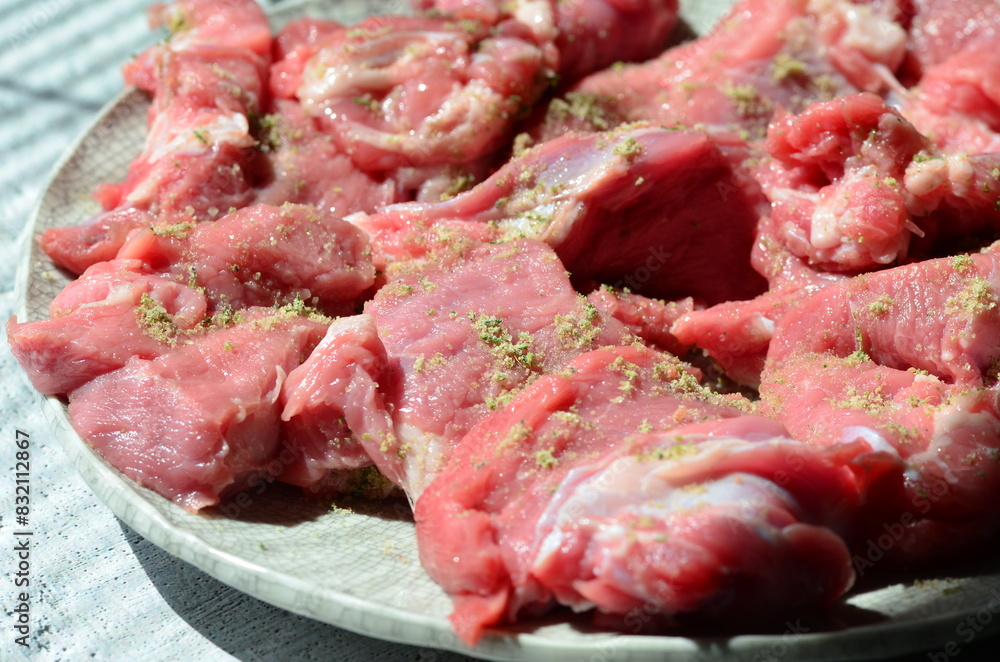 sliced veal, with spices, close up view of fresh meat sliced veal, with spices, close up view of fresh meat