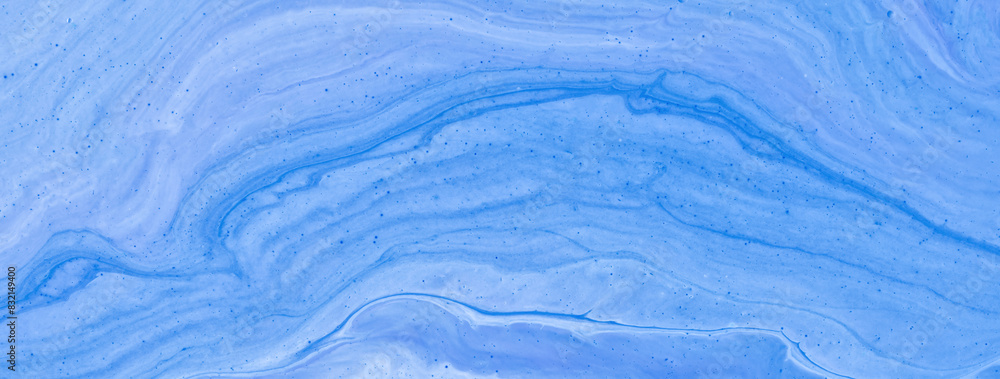 Abstract fluid art background light blue colors. Liquid marble. Acrylic painting on canvas with denim gradient. Abstract fluid art background light blue colors. Liquid marble. Acrylic painting on canvas with denim gradient.