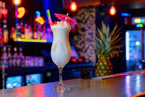 Tropical vibes  pina colada on bar counter with neon signs and palm trees, embracing summer warmth photo