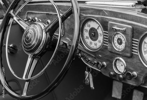 Nostalgic cockpit of an old classic car, black and white photography