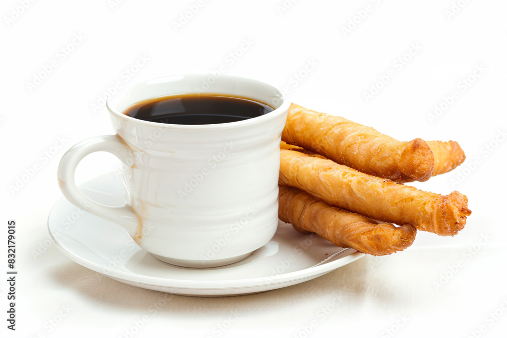 a cup of coffee and some fried food a cup of coffee and some fried food