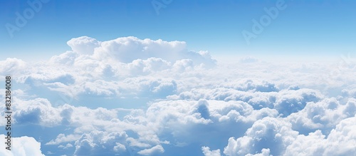 Flying over fluffy white clouds. Creative banner. Copyspace image
