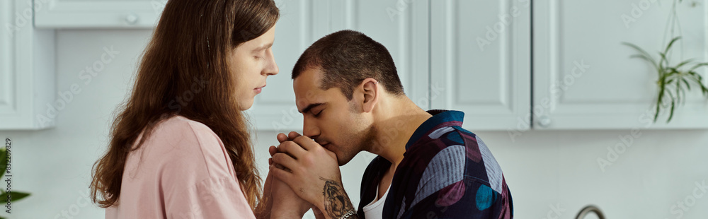 a gay couple, in casual clothes, spending quality time together in a kitchen. a gay couple, in casual clothes, spending quality time together in a kitchen.