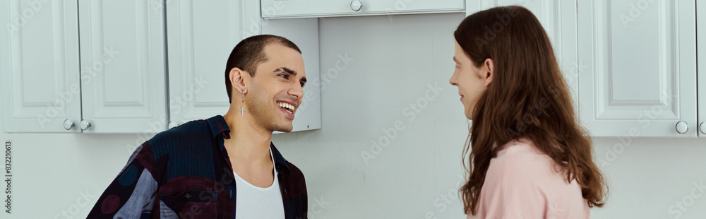 a gay couple, are standing together in a warm kitchen, bonding over cooking and sharing moments of joy.