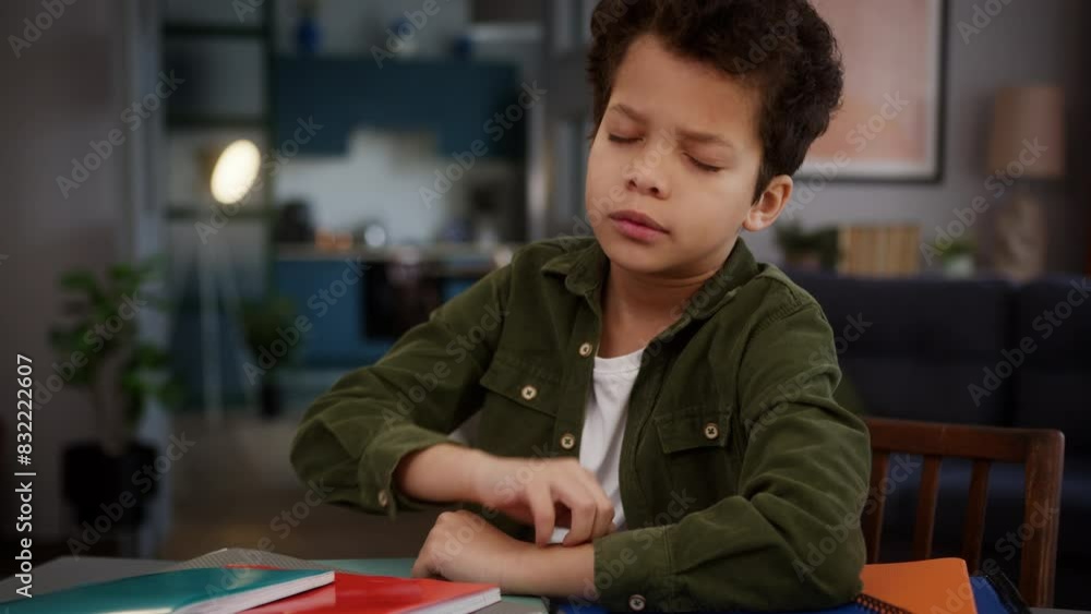 African American multiracial multiethnic sad tired exhausted fatigued stressed yawn need sleep lack energy napping sleeping little boy son kid child pupil at home education lying on books at table African American multiracial multiethnic sad tired exhausted fatigued stressed yawn need sleep lack energy napping sleeping little boy son kid child pupil at home education lying on books at table
